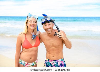 Couple On The Beach Is Going To Swim And Snorkle On Hawaii Beach