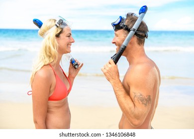 Couple On The Beach Is Going To Swim And Snorkle On Hawaii Beach