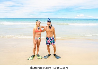 Couple On The Beach Is Going To Swim And Snorkle On Hawaii Beach