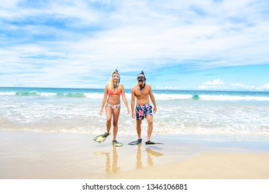 Couple On The Beach Is Going To Swim And Snorkle On Hawaii Beach