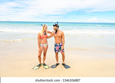 Couple On The Beach Is Going To Swim And Snorkle On Hawaii Beach