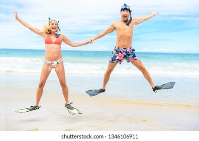 Couple On The Beach Is Going To Swim And Snorkle On Hawaii Beach