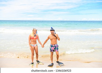 Couple On The Beach Is Going To Swim And Snorkle On Hawaii Beach