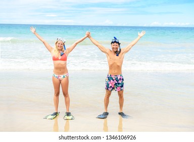 Couple On The Beach Is Going To Swim And Snorkle On Hawaii Beach