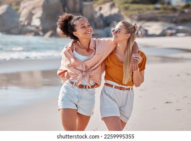 Couple on beach, lesbian and happy with travel, gay women hug outdoor with adventure and freedom to love by ocean. Interracial relationship, holiday in Australia and lgbtq with commitment happiness - Powered by Shutterstock