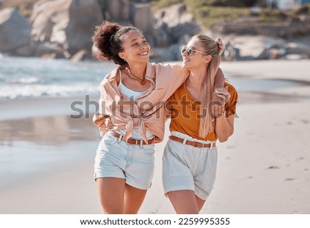 Couple on beach, lesbian and happy with travel, gay women hug outdoor with adventure and freedom to love by ocean. Interracial relationship, holiday in Australia and lgbtq with commitment happiness