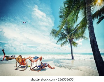 Couple On The Beach At Tropical Resort Travel Magazine Concept