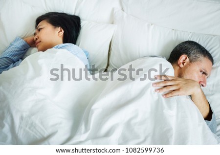 Couple on a bed having a problem