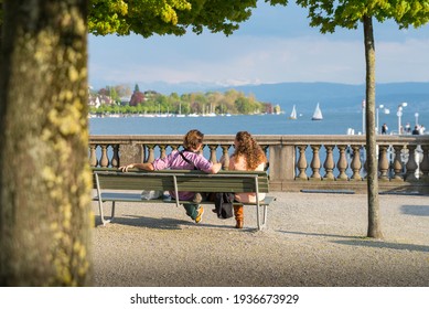 Couple on bench at lakeside Zurich