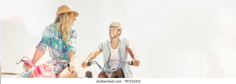 Couple On Bike Ride By The Beach