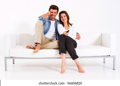 Couple On The Couch Watching TV