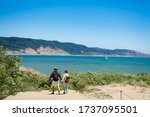 Couple on hiking trip. People hiking on summer vacation. Año Nuevo State Park , California, USA