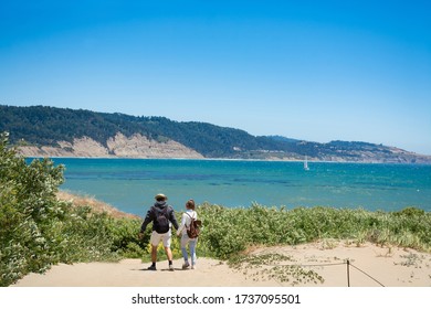 Couple On Hiking Trip. People Hiking On Summer Vacation. Año Nuevo State Park , California, USA