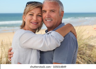 Couple on holiday by the seaside - Powered by Shutterstock