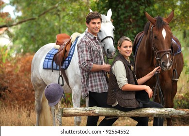 A Couple On A Horse Ride.