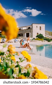 Couple On Luxury Vacation Relaxing By The Pool At An Agriturismo In Sicily Italy. Mid Age Couple On Vacation In Sicilia