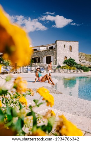 couple on luxury vacation relaxing by the pool at an Agriturismo in Sicily Italy. mid age couple on vacation in Sicilia Foto d'archivio © 