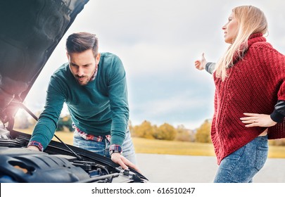 Couple On The Road Having Problem With A Car. Broken Down Car On The Road