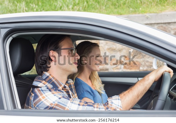 Couple on a road trip in\
their car