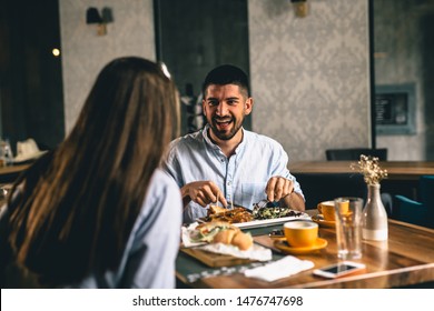 Couple On Romantic Dinner In Fancy Restaurant