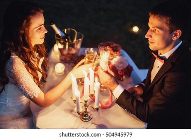 couple on a romantic picnic by candlelight
