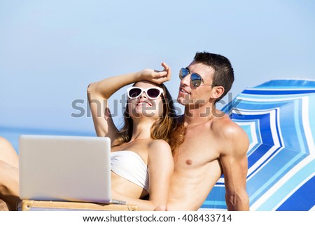 Couple on summer holidays vacation on tropical beach.