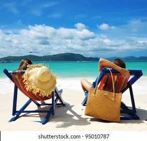 Couple on a tropical beach - Powered by Shutterstock