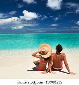 Couple On A Tropical Beach At Maldives