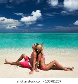 Couple On A Tropical Beach At Maldives