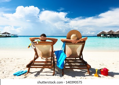 Couple On A Tropical Beach At Maldives