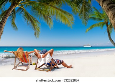 Couple On A Tropical Beach In The Maldives