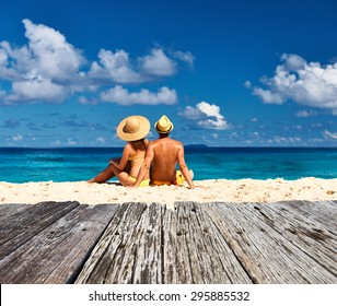 Couple on a tropical beach at Seychelles, La Digue