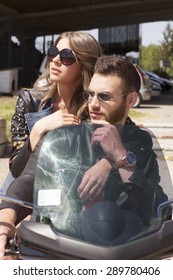 Couple On A Vespa On A Summer Day