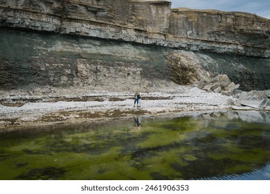 A couple on a walk on the seashore of the Baltic Sea near Paldiski Clint. Drone point of view photo.  - Powered by Shutterstock