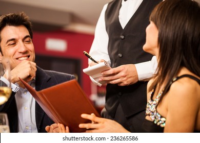 Couple ordering food in a restaurant - Powered by Shutterstock