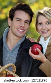 Couple Out Picking Apples