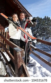 Couple Outside A Ski Lodge