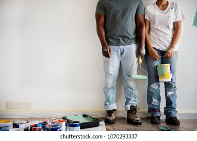 Couple Painting House Wall