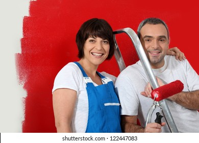 Couple Painting Wall Red