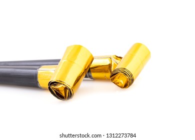 Couple Of Party Horn Blowers In Yellow/gold And Black In Close Up