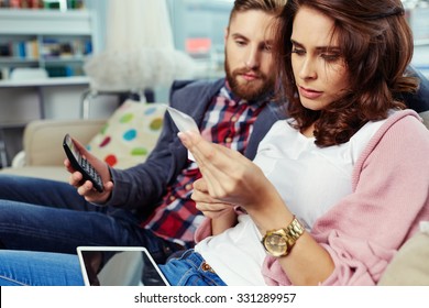 Couple Paying Bills With Digital Tablet