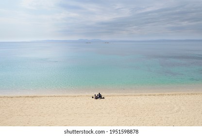 A Couple People Alone In The Sandy Beach, Roses, Alt Empordà, Catalonia, Spain