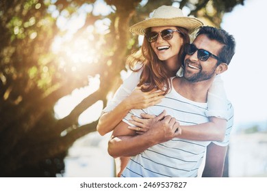 Couple, people and joy on piggyback in outdoor with lens flare for summer holiday and fun in Spain. Relationship, love and smile with support on vacation, trip and travel together as soulmate - Powered by Shutterstock