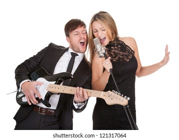 Couple Performs Duet Sharing Same Microphone To Everybody.