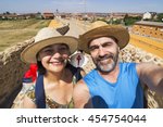 couple pilgrims selfie in Hospital de Orbigo bridge  , Way of St James,  Camino de  Santiago, to Compostela, Leon, Spain