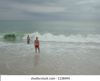 Couple Play In The Waves Caused By Hurricane Ivan