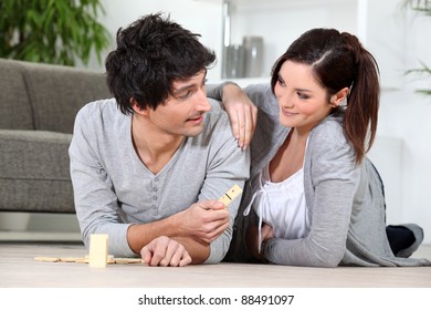 Couple Playing Dominoes