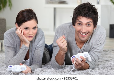 Couple playing a  games console