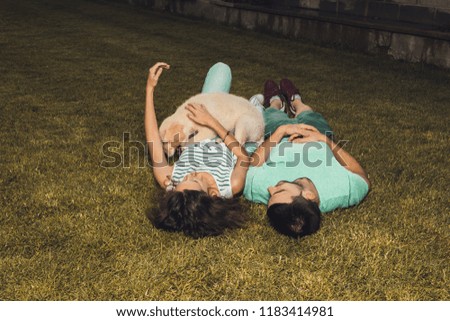 Similar – Women friends with sunglasses looking each other lying