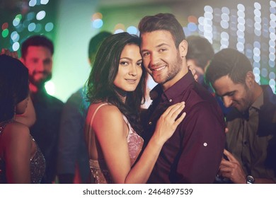 Couple, portrait and dance in club at night on date and hug with love in relationship. Happy, people and embrace together in celebration at neon disco, party or rave at techno music festival - Powered by Shutterstock